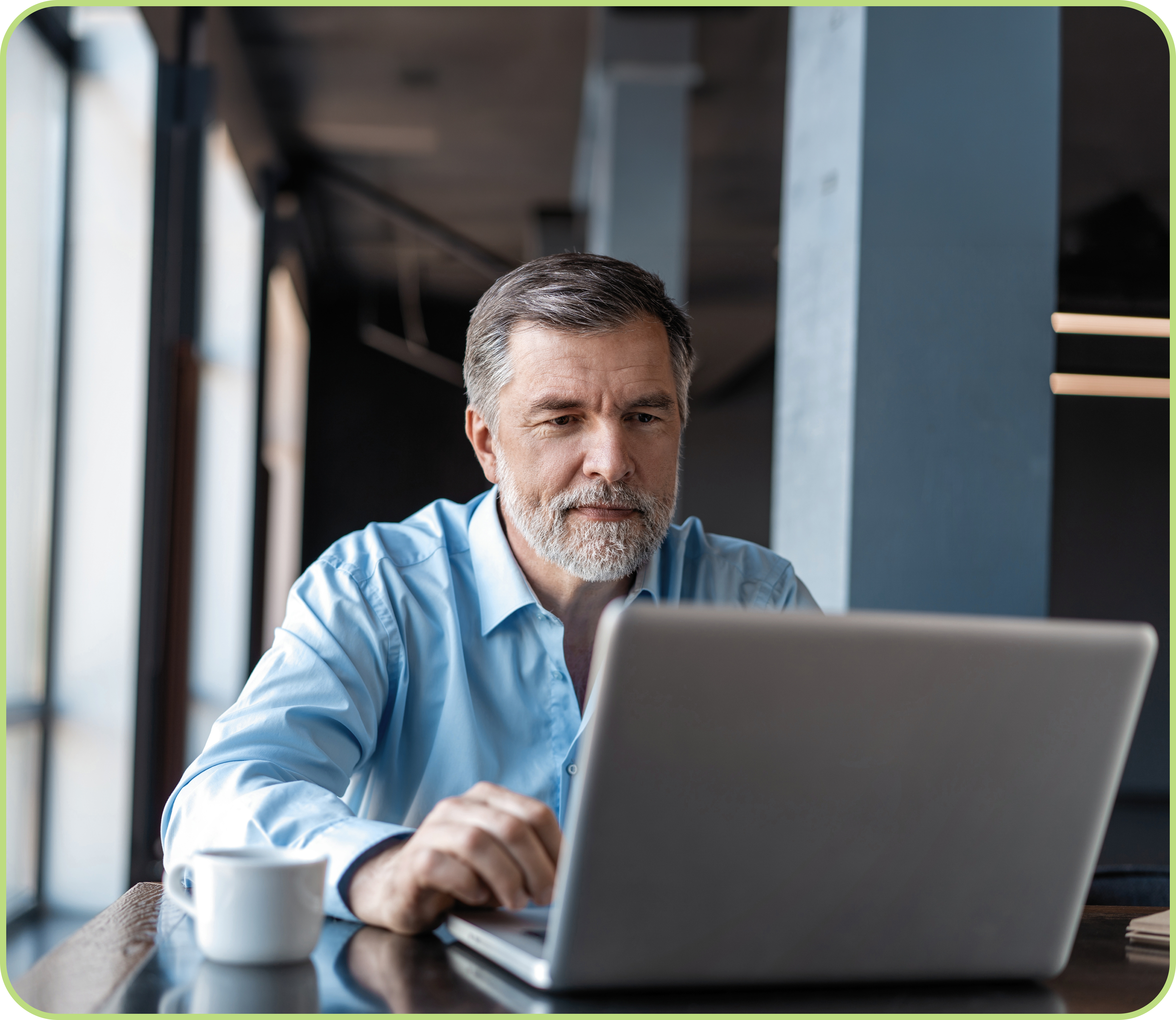 Picture of a man working with Therap application on his tablet.