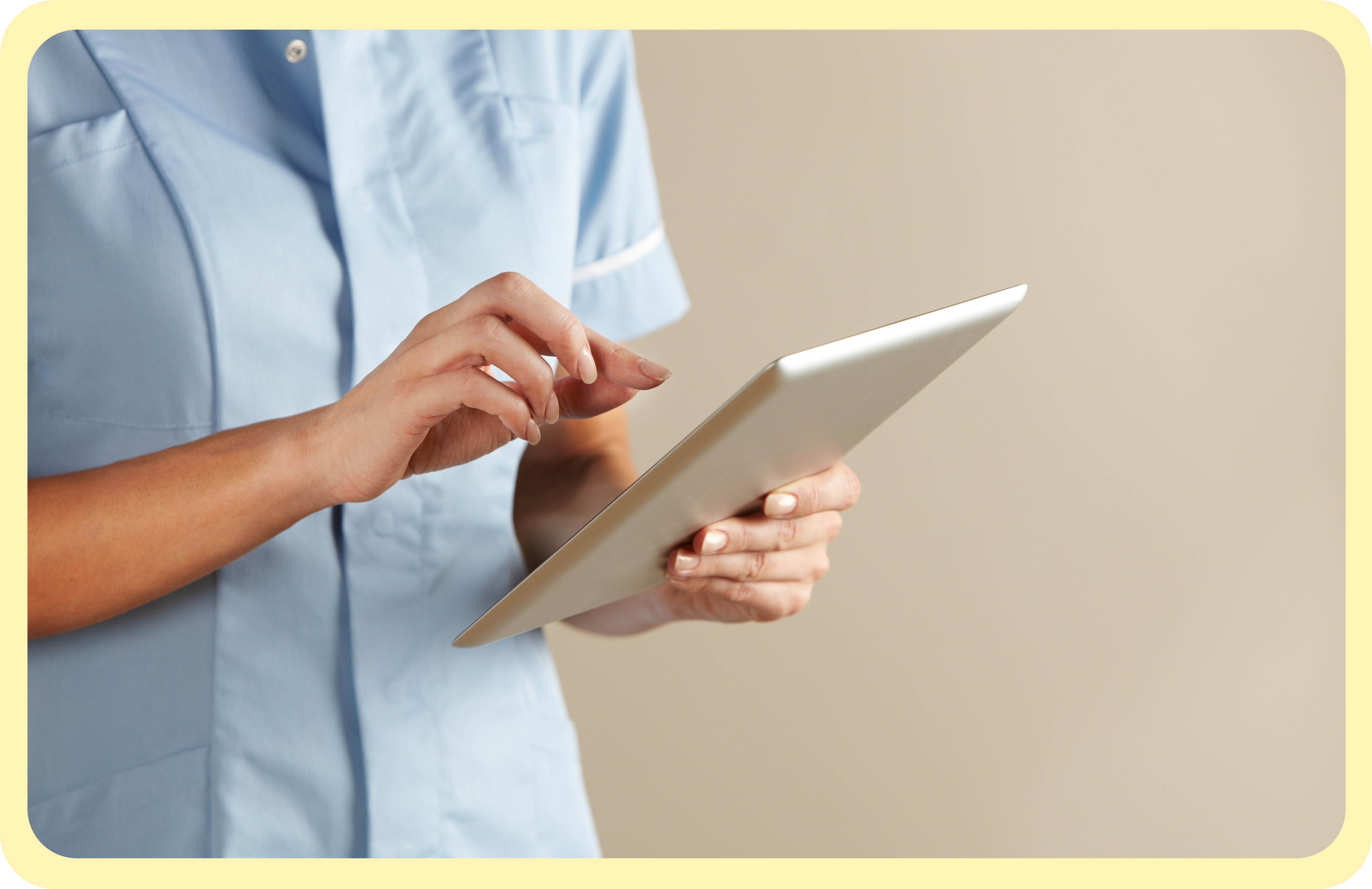 Picture of a nurse holding a tablet and looking at data